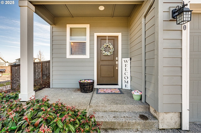 property entrance with fence