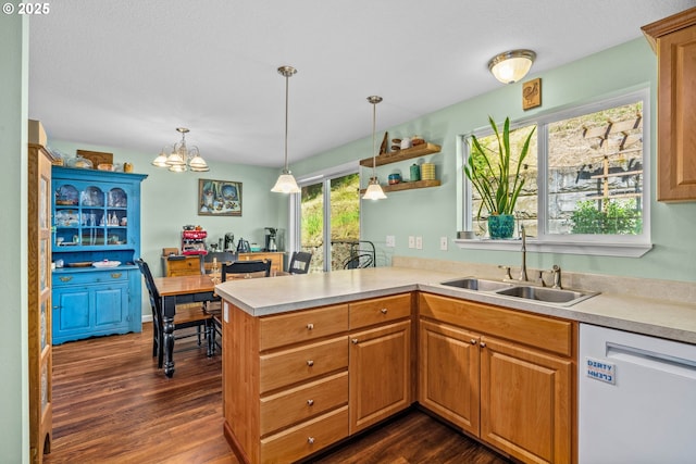 34637 E Knox Butte Rd, Albany, OR 97322 - kitchen with white dishwasher, a sink, dark wood-style floors, light countertops, and a peninsula