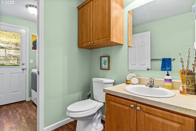 34637 E Knox Butte Rd, Albany, OR 97322 - half bath featuring wood finished floors, toilet, vanity, and baseboards