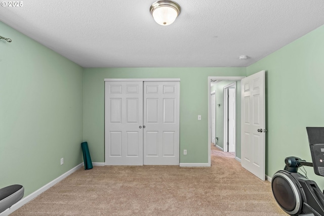 34637 E Knox Butte Rd, Albany, OR 97322 - workout room with carpet, a textured ceiling, and baseboards