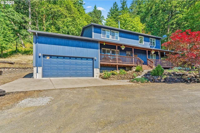 34637 E Knox Butte Rd, Albany, OR 97322 - view of front facade with covered porch, concrete driveway, and a garage