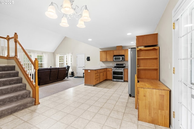 40510 NE 261st Ct, Amboy, WA 98601 - kitchen with open shelves, open floor plan, appliances with stainless steel finishes, a chandelier, and a peninsula