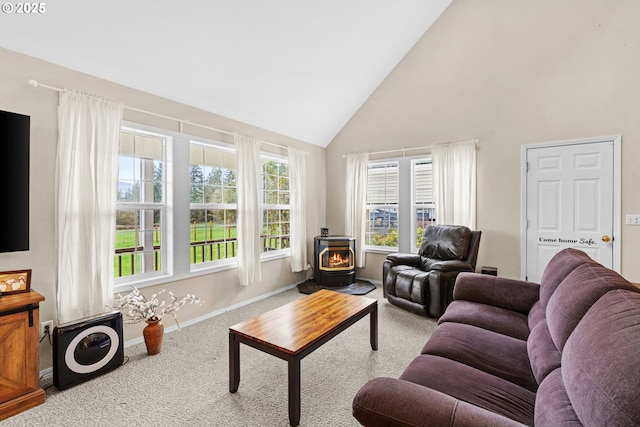 40510 NE 261st Ct, Amboy, WA 98601 - carpeted living room with high vaulted ceiling, a wood stove, and baseboards