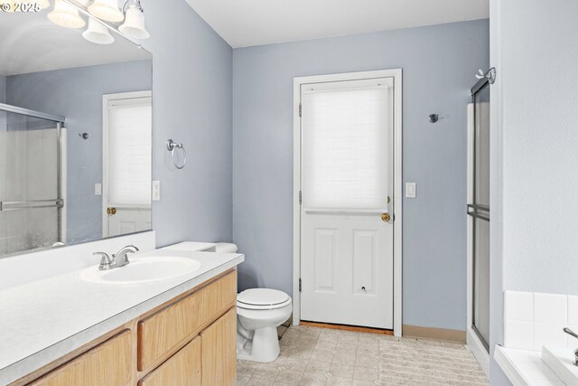 40510 NE 261st Ct, Amboy, WA 98601 - full bath featuring toilet, a shower stall, vanity, and a bathtub