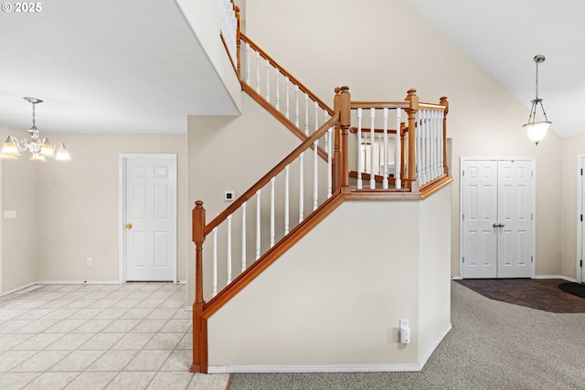 40510 NE 261st Ct, Amboy, WA 98601 - staircase with carpet flooring, a notable chandelier, baseboards, and a towering ceiling