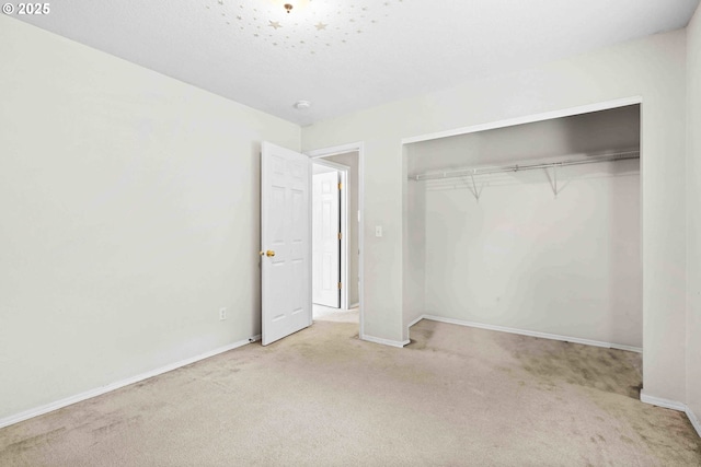 40510 NE 261st Ct, Amboy, WA 98601 - unfurnished bedroom featuring a closet, baseboards, and carpet floors