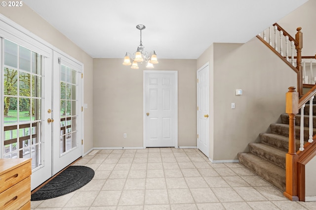 40510 NE 261st Ct, Amboy, WA 98601 - entrance foyer with french doors, baseboards, a notable chandelier, and stairs