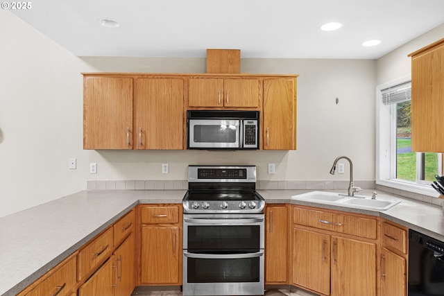 40510 NE 261st Ct, Amboy, WA 98601 - kitchen featuring light countertops, a sink, and appliances with stainless steel finishes