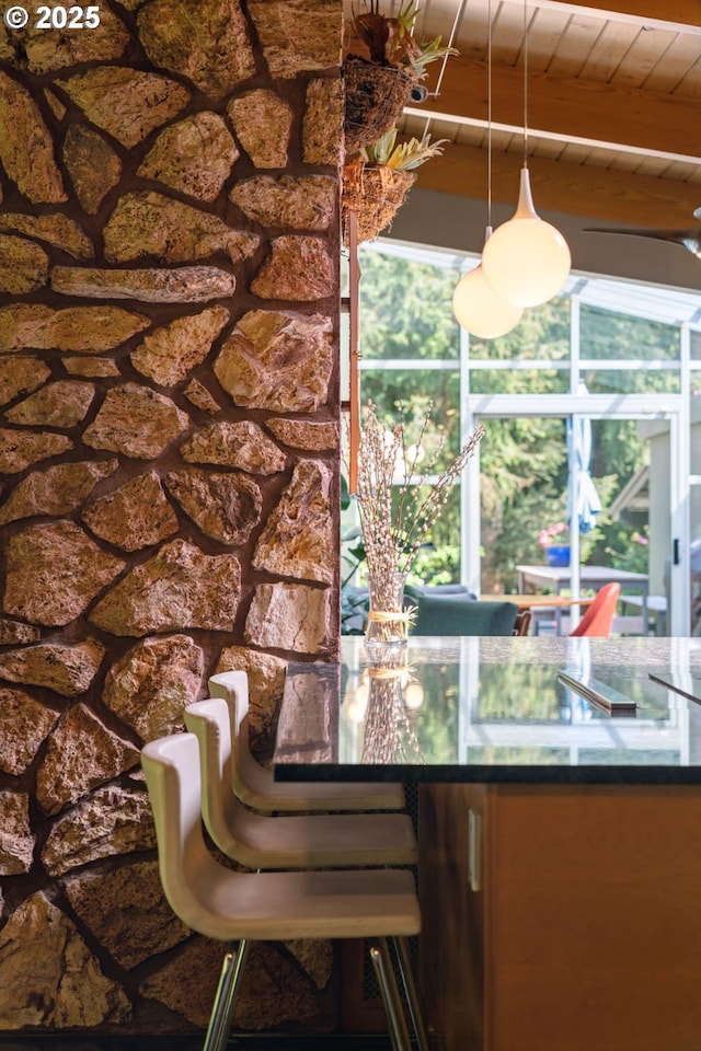 dining area with wooden ceiling and beam ceiling