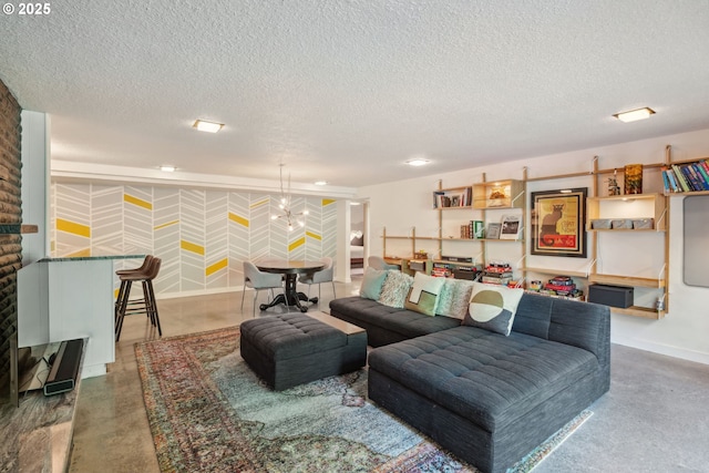living room featuring baseboards, a textured ceiling, and concrete floors