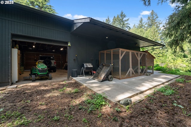 back of house featuring an outdoor structure and exterior structure