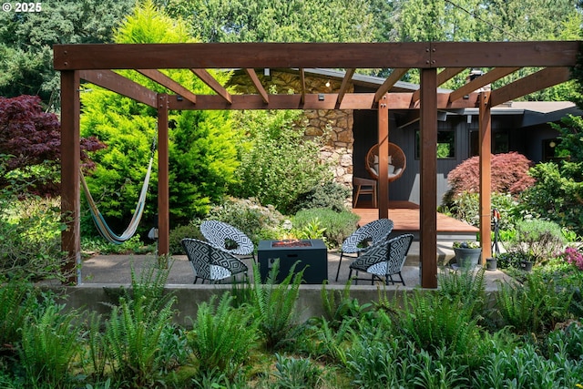 view of patio / terrace with a pergola and an outdoor fire pit