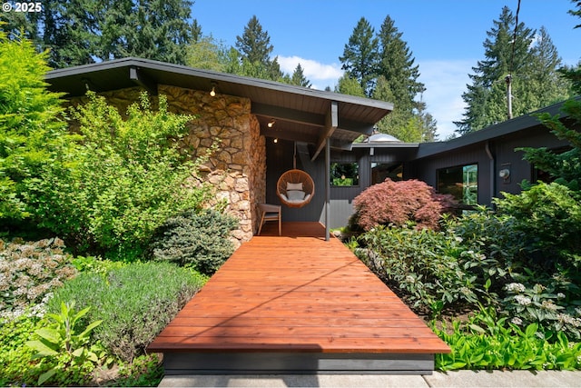 property entrance with stone siding