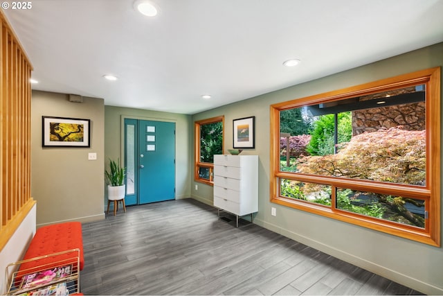 foyer entrance with recessed lighting, baseboards, and wood finished floors