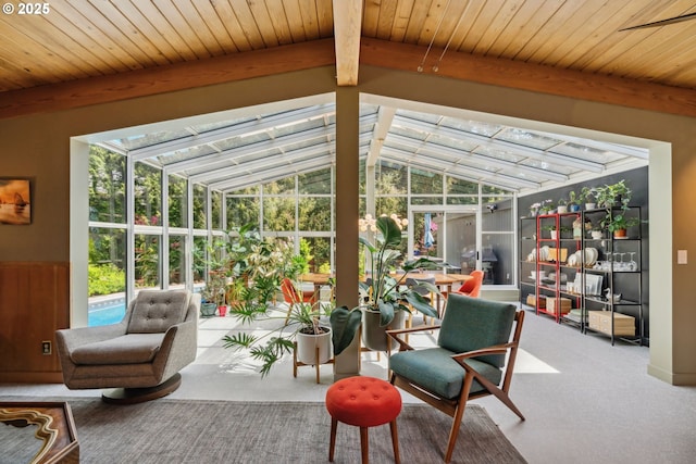sunroom with beam ceiling and a wealth of natural light