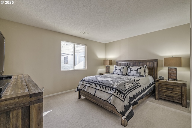 carpeted bedroom with a textured ceiling