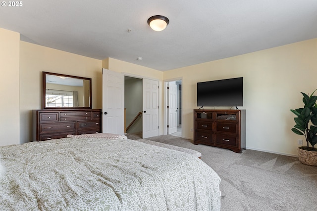 bedroom with baseboards and carpet floors