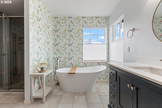 bathroom with a soaking tub, wallpapered walls, a shower stall, and vanity