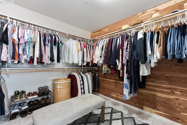 spacious closet featuring tile patterned flooring