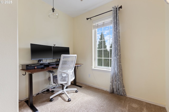 carpeted office featuring baseboards