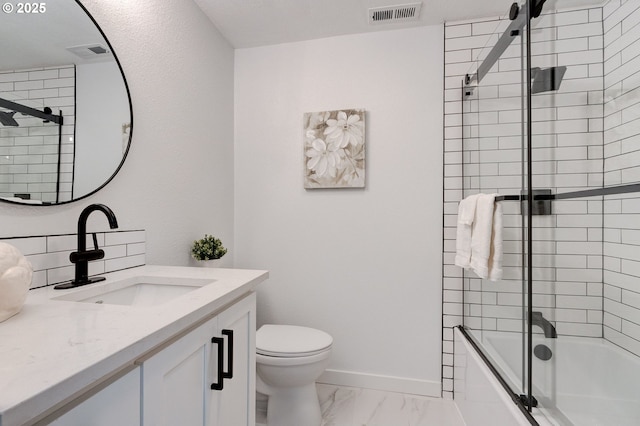 bathroom featuring toilet, marble finish floor, vanity, and visible vents