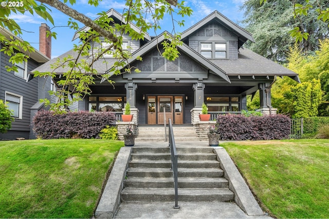 2225 NE 22nd Ave, Portland, OR 97212 - view of front facade with a front lawn, a porch, and roof with shingles