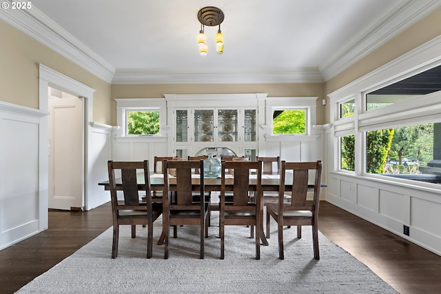 2225 NE 22nd Ave, Portland, OR 97212 - dining area featuring a decorative wall, dark wood-type flooring, a chandelier, healthy amount of natural light, and ornamental molding