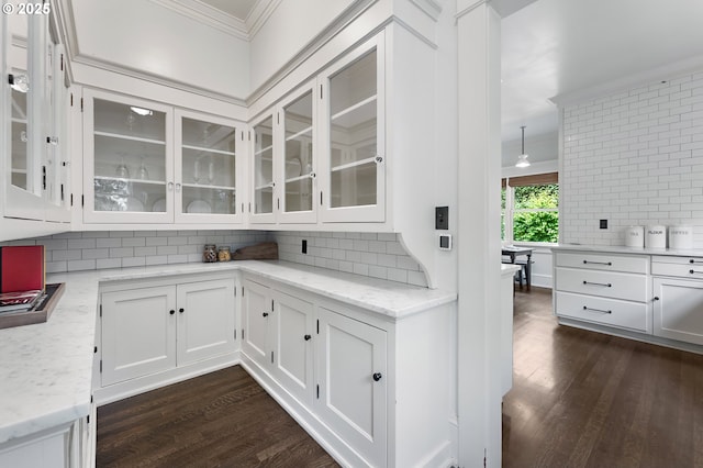 2225 NE 22nd Ave, Portland, OR 97212 - bar featuring crown molding, backsplash, and dark wood finished floors
