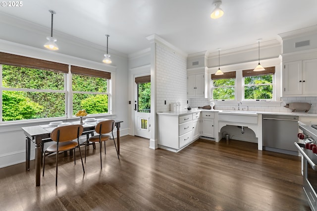 2225 NE 22nd Ave, Portland, OR 97212 - kitchen featuring stainless steel appliances, decorative backsplash, ornamental molding, light countertops, and white cabinetry