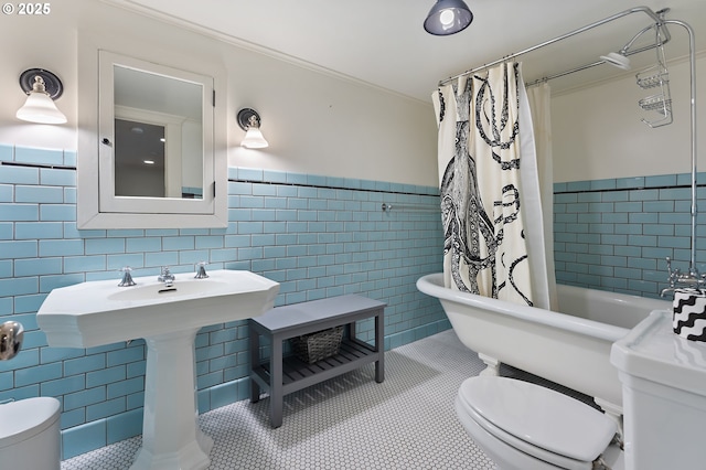 2225 NE 22nd Ave, Portland, OR 97212 - bathroom featuring tile walls, tile patterned floors, a wainscoted wall, and shower / tub combo
