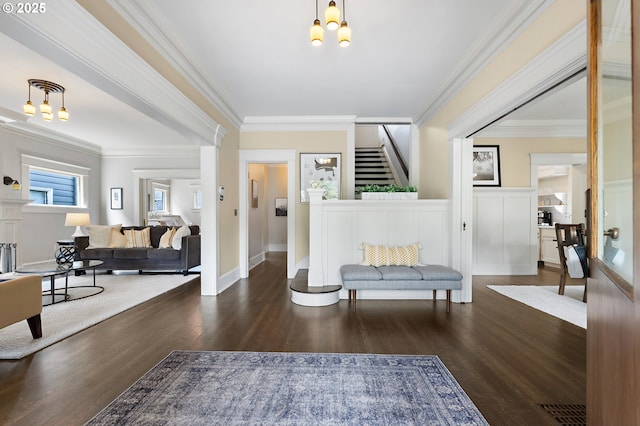 2225 NE 22nd Ave, Portland, OR 97212 - entrance foyer with wood finished floors, crown molding, stairway, and a chandelier