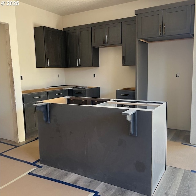 kitchen featuring light hardwood / wood-style floors and a kitchen island