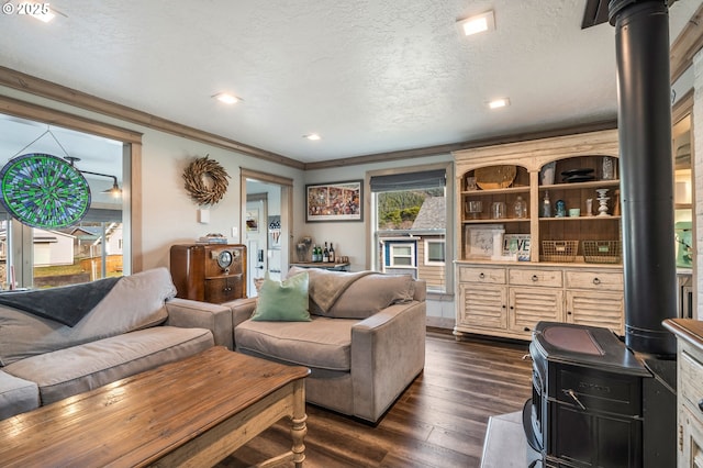 128 NW 20th Ave, Rockaway Beach, OR 97136 - living room with dark wood-style floors, crown molding, a textured ceiling, and recessed lighting