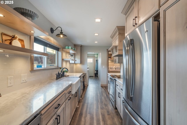 128 NW 20th Ave, Rockaway Beach, OR 97136 - kitchen featuring appliances with stainless steel finishes, open shelves, dark wood-type flooring, tasteful backsplash, and a sink