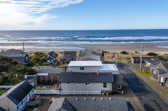 128 NW 20th Ave, Rockaway Beach, OR 97136 - aerial perspective of suburban area featuring waterfront with a beach