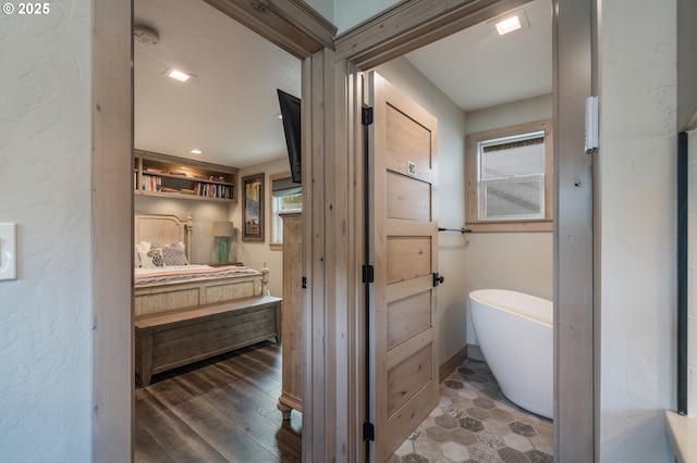 128 NW 20th Ave, Rockaway Beach, OR 97136 - full bath with a soaking tub, vanity, and wood finished floors
