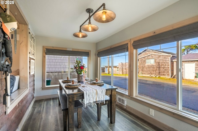 128 NW 20th Ave, Rockaway Beach, OR 97136 - dining space featuring baseboards and dark wood-type flooring