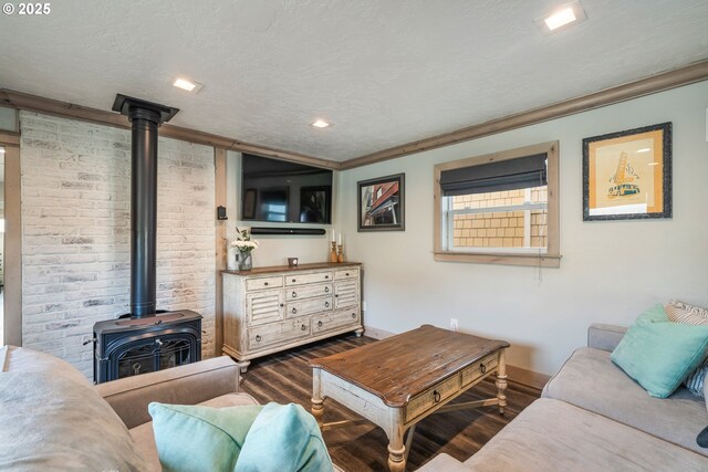 128 NW 20th Ave, Rockaway Beach, OR 97136 - living area with wood finished floors, a wood stove, baseboards, recessed lighting, and ornamental molding