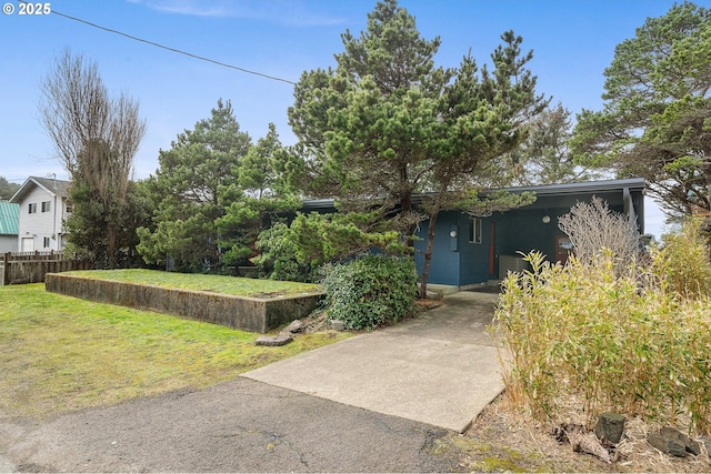 exterior space with a front yard and fence