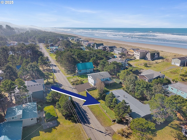 bird's eye view with a beach view and a water view