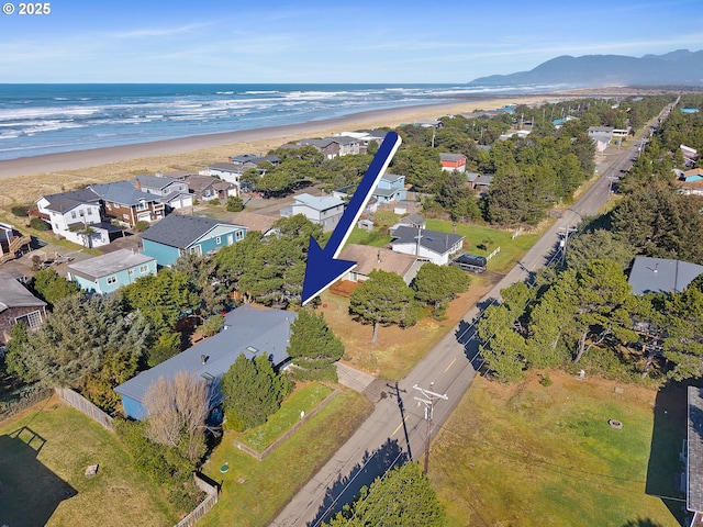 birds eye view of property with a residential view and a beach view