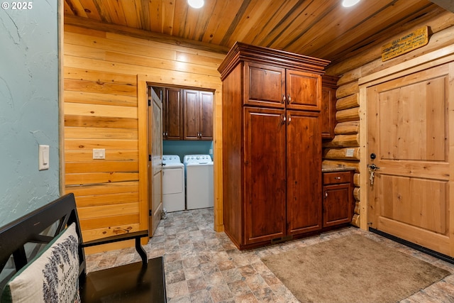 400 Rockinghorse Dr, Grants Pass, OR 97527 - foyer entrance with wooden ceiling, independent washer and dryer, log walls, recessed lighting, and stone finish flooring