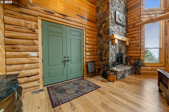 400 Rockinghorse Dr, Grants Pass, OR 97527 - foyer entrance with rustic walls, hardwood / wood-style floors, and a high ceiling