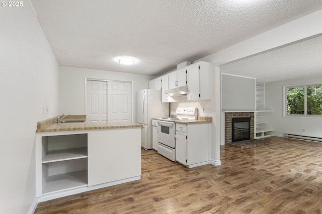 7124 SW Murray Blvd, Beaverton, OR 97008 - kitchen with white appliances, under cabinet range hood, wood finished floors, a textured ceiling, and white cabinets
