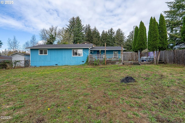 5053 NE 50th St, Neotsu, OR 97364 - back of house featuring a fenced backyard, a wooden deck, and crawl space