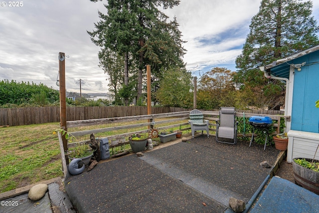 5053 NE 50th St, Neotsu, OR 97364 - fenced backyard with a patio area and area for grilling