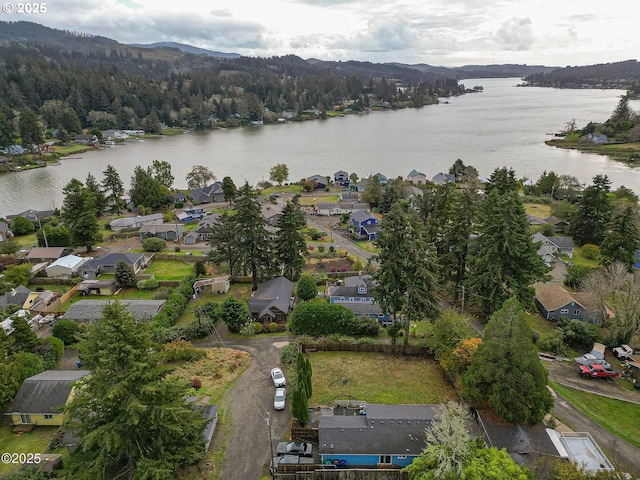 5053 NE 50th St, Neotsu, OR 97364 - aerial view of property and surrounding area with a large body of water and nearby suburban area