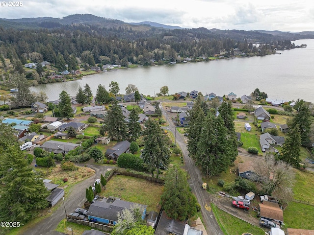 5053 NE 50th St, Neotsu, OR 97364 - aerial view of property and surrounding area with a water and mountain view and nearby suburban area