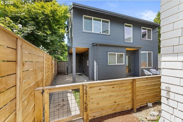 2415 NE 38th Ave Unit B, Portland, OR 97212 - back of property with a fenced backyard and a gate