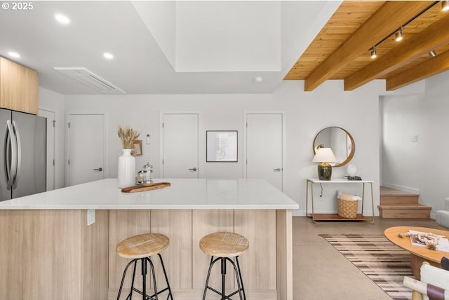 2415 NE 38th Ave Unit B, Portland, OR 97212 - kitchen featuring a kitchen bar, light countertops, recessed lighting, modern cabinets, and a kitchen island